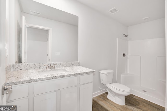 1184 Bluecoat Cir Unit 84, Hampton, GA 30228 - full bathroom with wood finished floors, vanity, and a shower
