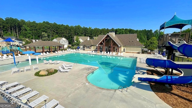 420 Ashbury Cir, Dallas, GA 30157 - community pool featuring a patio and a water slide