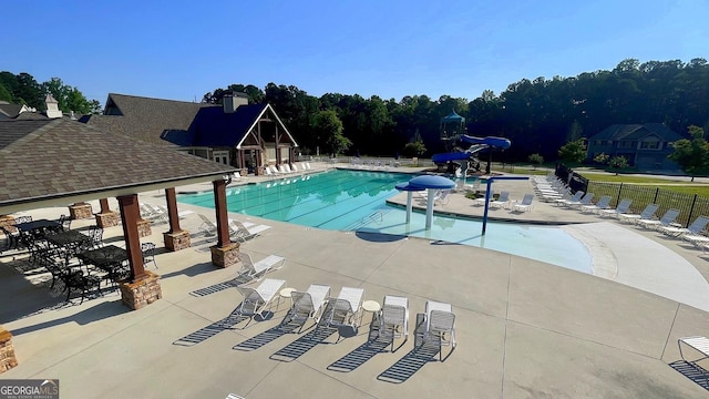 420 Ashbury Cir, Dallas, GA 30157 - community pool featuring a water slide and a patio area