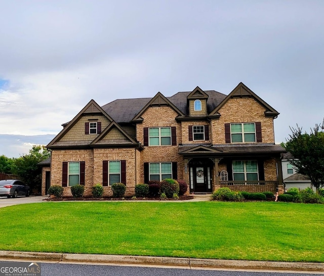 206 Birchin Dr, Woodstock, GA 30188 - craftsman inspired home with a front lawn, covered porch, brick siding, and concrete driveway