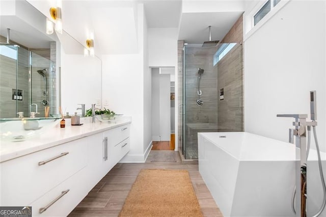 167 Sampson St, Atlanta, GA 30312 - full bath featuring a shower stall, vanity, a soaking tub, and wood finished floors