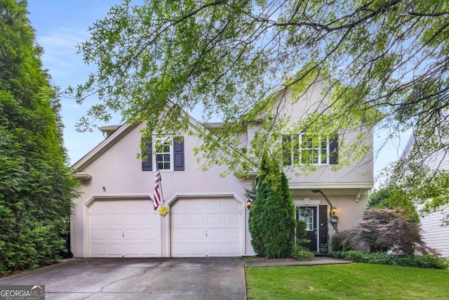 5035 Foxberry Ln, Roswell, GA 30075 - traditional-style house featuring stucco siding, concrete driveway, an attached garage, and a front lawn
