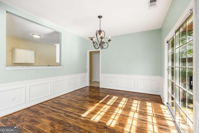 5035 Foxberry Ln, Roswell, GA 30075 - unfurnished room with a chandelier, wood finished floors, and wainscoting