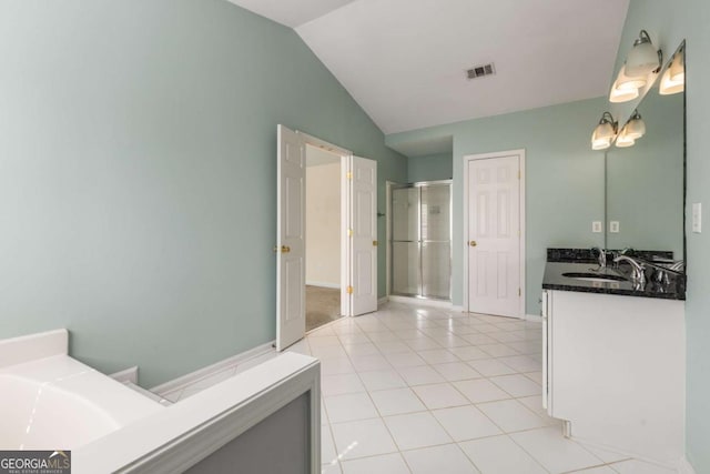 5035 Foxberry Ln, Roswell, GA 30075 - bathroom featuring a stall shower, vanity, vaulted ceiling, tile patterned floors, and a tub to relax in
