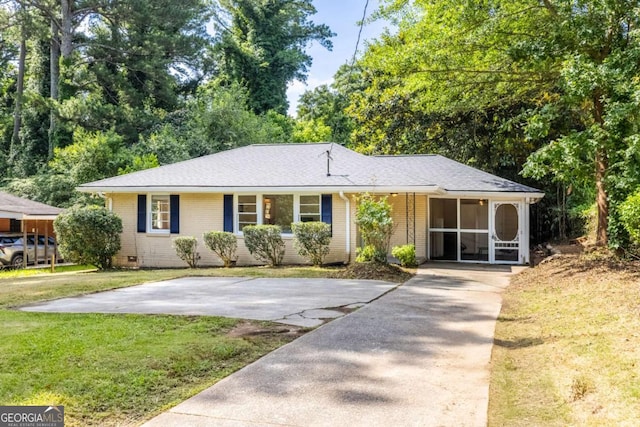 3205 Mcafee Rd, Decatur, GA 30032 - single story home with a front lawn, brick siding, concrete driveway, and a shingled roof
