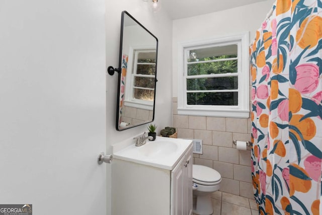 3205 Mcafee Rd, Decatur, GA 30032 - bathroom with tile walls, vanity, tile patterned floors, and curtained shower