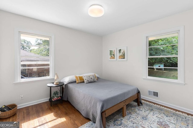 3205 Mcafee Rd, Decatur, GA 30032 - bedroom featuring multiple windows and wood finished floors