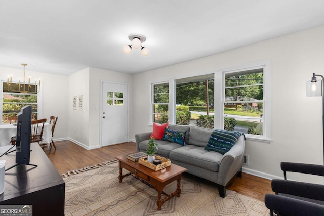 3205 Mcafee Rd, Decatur, GA 30032 - living room with a chandelier and wood finished floors