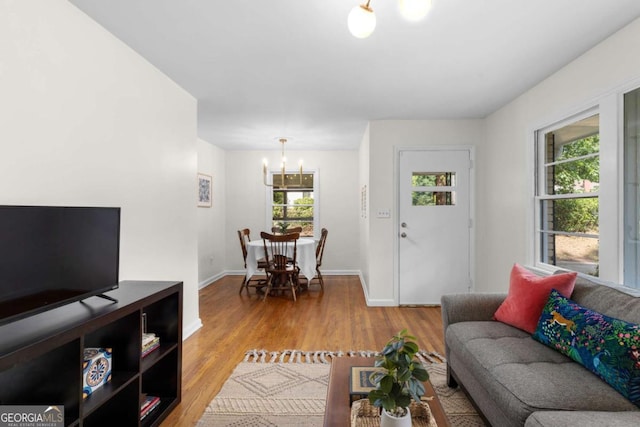 3205 Mcafee Rd, Decatur, GA 30032 - living room with a chandelier and wood finished floors