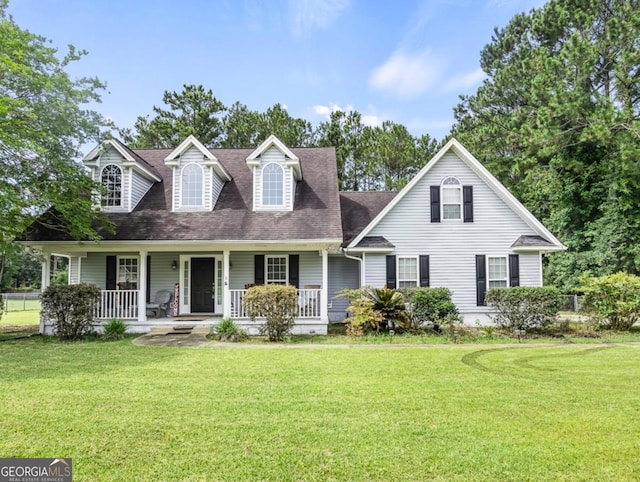 109 Cains Trce, Brunswick, GA 31523 - view of front of house with a front lawn, a porch, and a shingled roof