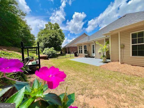 121 Pinnacle Ln, Mcdonough, GA 30253 - view of grassy yard with a patio area