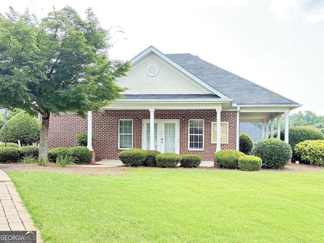 121 Pinnacle Ln, Mcdonough, GA 30253 - view of front of home with a front lawn, brick siding, a porch, and a shingled roof