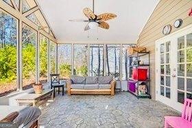 380 Victorian Ln, Duluth, GA 30097 - sunroom / solarium featuring french doors, healthy amount of natural light, an outdoor living space, and high vaulted ceiling