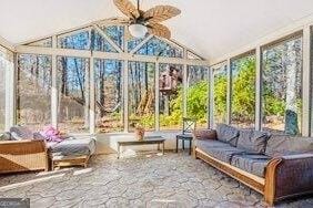 380 Victorian Ln, Duluth, GA 30097 - sunroom with vaulted ceiling and stone flooring
