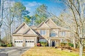 380 Victorian Ln, Duluth, GA 30097 - view of front of property with driveway, a garage, and a front yard