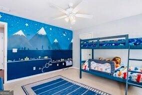 380 Victorian Ln, Duluth, GA 30097 - bedroom with a ceiling fan and baseboards
