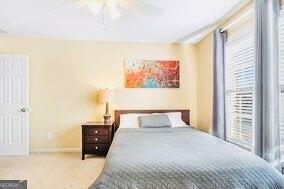 380 Victorian Ln, Duluth, GA 30097 - carpeted bedroom with baseboards and ceiling fan