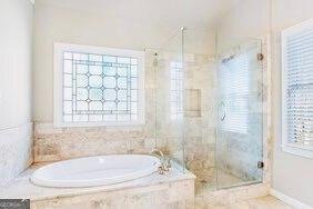 380 Victorian Ln, Duluth, GA 30097 - bathroom with a stall shower and a bath