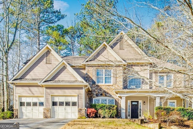 380 Victorian Ln, Duluth, GA 30097 - view of front of house featuring concrete driveway, stone siding, and an attached garage