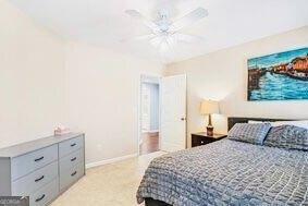 380 Victorian Ln, Duluth, GA 30097 - bedroom featuring baseboards and a ceiling fan