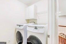 380 Victorian Ln, Duluth, GA 30097 - laundry room featuring washing machine and dryer and cabinet space