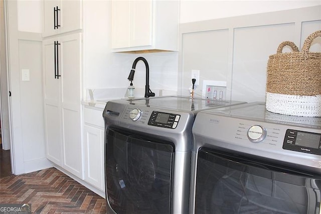 688 Harmony Rd, Temple, GA 30179 - laundry room with separate washer and dryer, cabinet space, and brick flooring