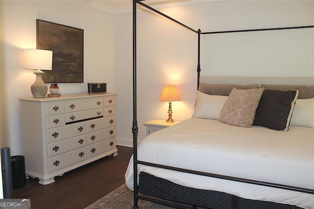 688 Harmony Rd, Temple, GA 30179 - bedroom with dark wood-style flooring and baseboards