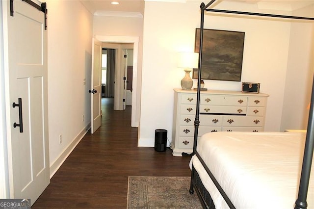 688 Harmony Rd, Temple, GA 30179 - bedroom with dark wood-style flooring, a barn door, ornamental molding, and recessed lighting