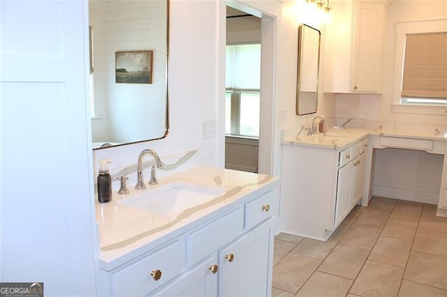 688 Harmony Rd, Temple, GA 30179 - full bathroom featuring two vanities and tile patterned floors