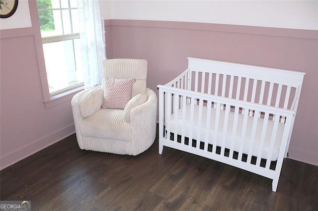 688 Harmony Rd, Temple, GA 30179 - bedroom with wood finished floors and a crib