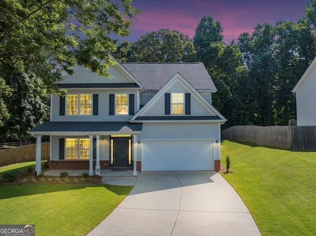 5195 Oaks Landing Ct, Sugar Hill, GA 30518 - view of front of house featuring driveway, brick siding, board and batten siding, and roof with shingles