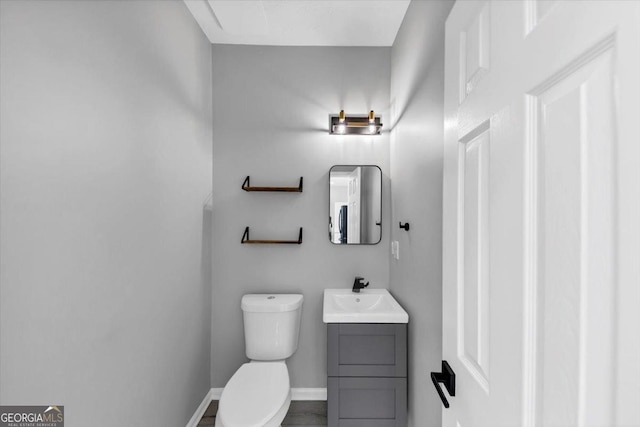 5195 Oaks Landing Ct, Sugar Hill, GA 30518 - bathroom featuring vanity and toilet