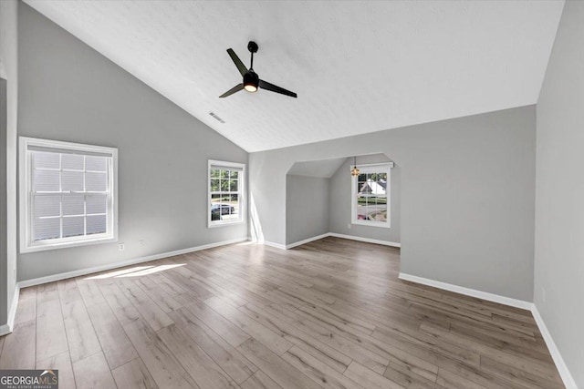 5195 Oaks Landing Ct, Sugar Hill, GA 30518 - unfurnished living room with vaulted ceiling, ceiling fan, and wood finished floors