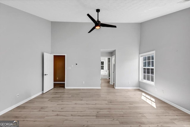 5195 Oaks Landing Ct, Sugar Hill, GA 30518 - unfurnished room featuring high vaulted ceiling, ceiling fan, and light wood finished floors