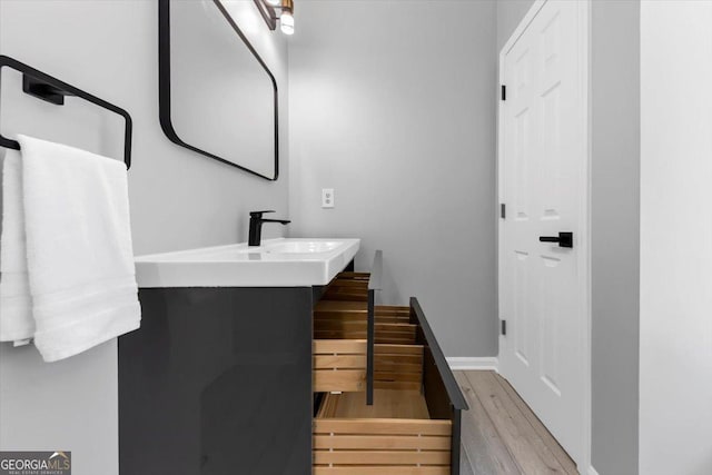 5195 Oaks Landing Ct, Sugar Hill, GA 30518 - bathroom featuring wood finished floors and vanity