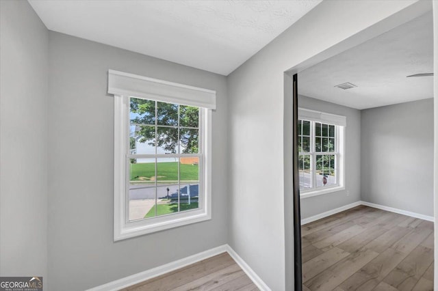 5195 Oaks Landing Ct, Sugar Hill, GA 30518 - unfurnished room featuring wood finished floors and baseboards
