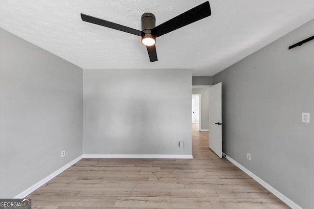 5195 Oaks Landing Ct, Sugar Hill, GA 30518 - unfurnished room featuring wood finished floors and ceiling fan