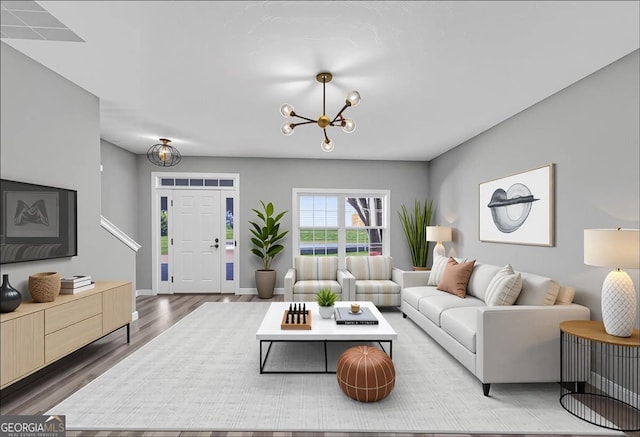 5195 Oaks Landing Ct, Sugar Hill, GA 30518 - living area featuring wood finished floors and a chandelier