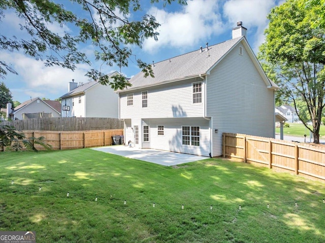 5195 Oaks Landing Ct, Sugar Hill, GA 30518 - back of house with a patio, a fenced backyard, and a chimney