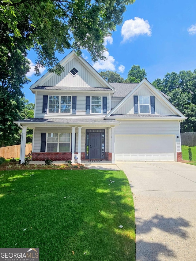5195 Oaks Landing Ct, Sugar Hill, GA 30518 - view of front of house with brick siding, driveway, an attached garage, a porch, and board and batten siding