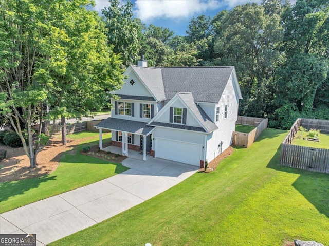5195 Oaks Landing Ct, Sugar Hill, GA 30518 - view of front of home with an attached garage, concrete driveway, covered porch, a shingled roof, and a chimney