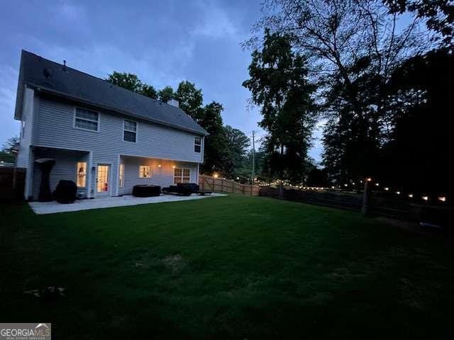 5195 Oaks Landing Ct, Sugar Hill, GA 30518 - back of house featuring a patio and a fenced backyard