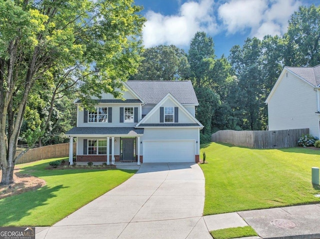 5195 Oaks Landing Ct, Sugar Hill, GA 30518 - view of front of property featuring driveway, a garage, board and batten siding, covered porch, and brick siding