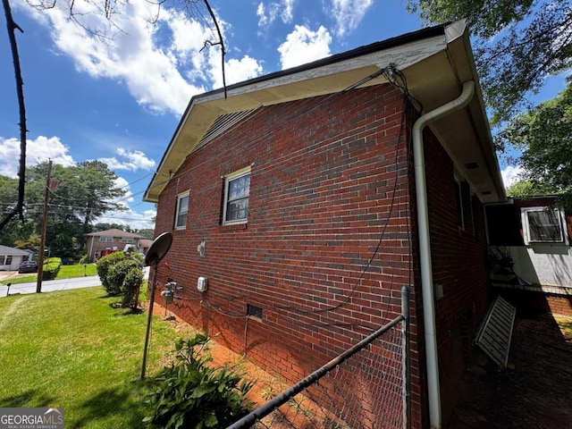 2933 Arlington Rd, East Point, GA 30344 - view of side of home with crawl space, a lawn, and brick siding