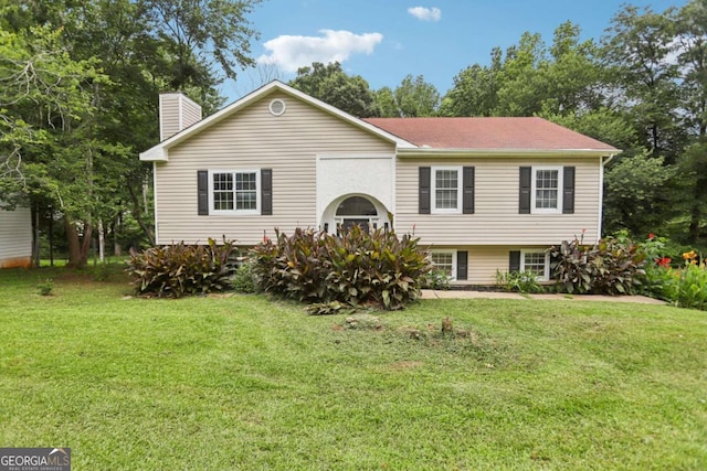 73 Azalea Dr, Villa Rica, GA 30180 - view of front of home with a front yard and a chimney