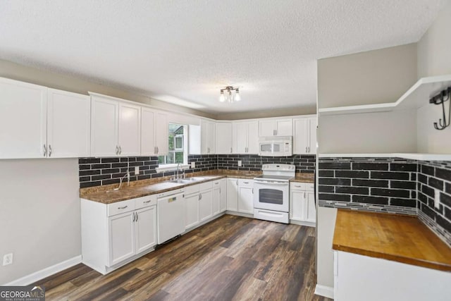 73 Azalea Dr, Villa Rica, GA 30180 - kitchen featuring white appliances, a textured ceiling, decorative backsplash, dark wood finished floors, and white cabinets