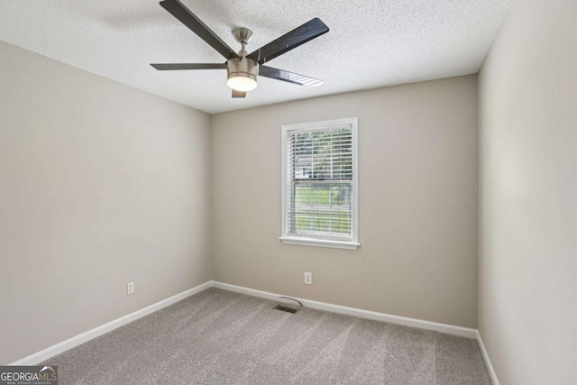 73 Azalea Dr, Villa Rica, GA 30180 - empty room featuring ceiling fan, carpet floors, and a textured ceiling