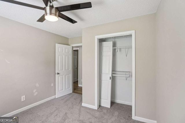 73 Azalea Dr, Villa Rica, GA 30180 - unfurnished bedroom with carpet floors, a closet, ceiling fan, and a textured ceiling