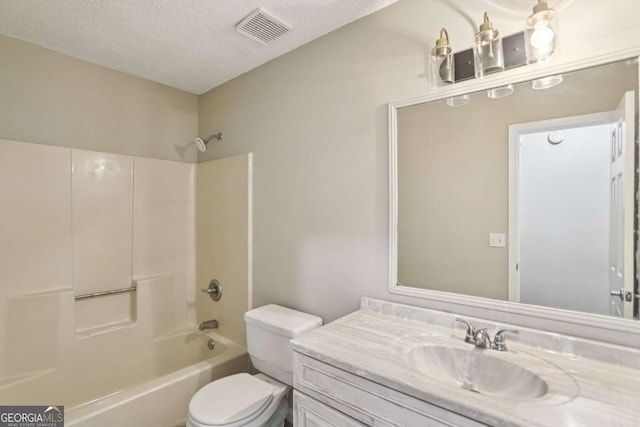 73 Azalea Dr, Villa Rica, GA 30180 - full bathroom featuring vanity, shower / bath combination, and a textured ceiling