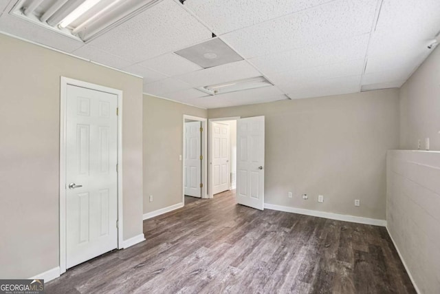 73 Azalea Dr, Villa Rica, GA 30180 - unfurnished bedroom featuring wood finished floors, attic access, and a paneled ceiling